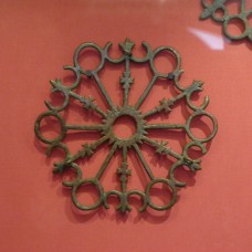 Candelabra, sun in the center with crosses on its rays